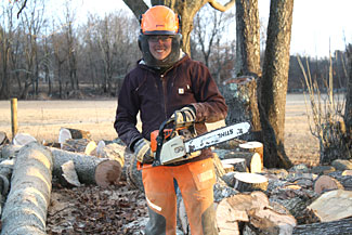 Intern with chainsaw